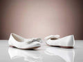 Ballerinaskor i satin med rosett